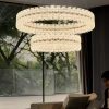 chandelier features two parallel rings adorned with diamond-cut crystal glass